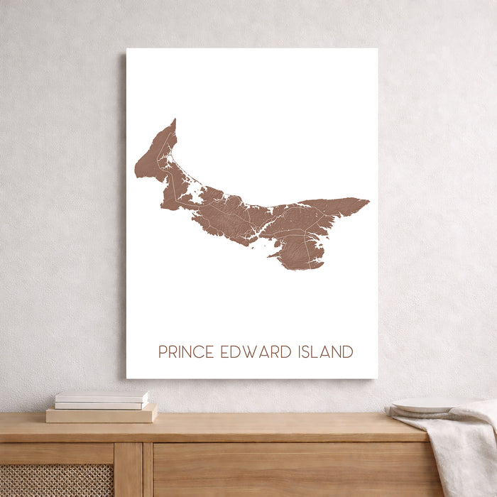 Map of Prince Edward Island on a white wall above a wooden surface