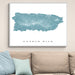 Framed map of Puerto Rico on a wall above a beige sofa with light blue pillows.
