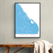 Framed map of Punta Cana on a wall above a wooden bench.