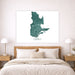 Framed map of Quebec on a wall above a bed in a bedroom.