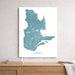 Map of Quebec in blue on a white background, framed and leaning against a light gray wall.