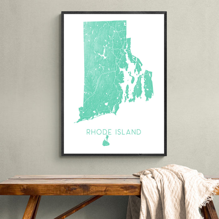 Framed map of Rhode Island on a wall above a wooden bench.