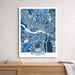 Map poster of Richmond, Virginia on a wall above a wooden surface.
