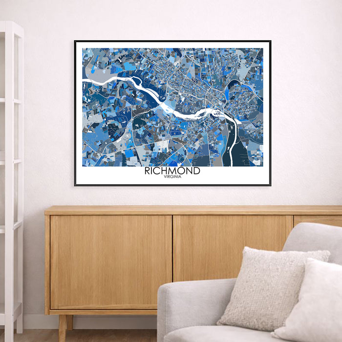Framed map of Richmond, Virginia on a wall above a wooden cabinet and sofa.