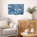 Framed map of Richmond on a wall above a sofa with decorative items.