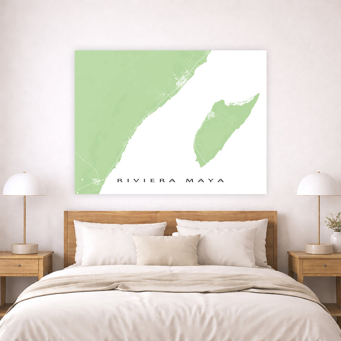 Map of Riviera Maya on a wall above a bed in a bedroom setting