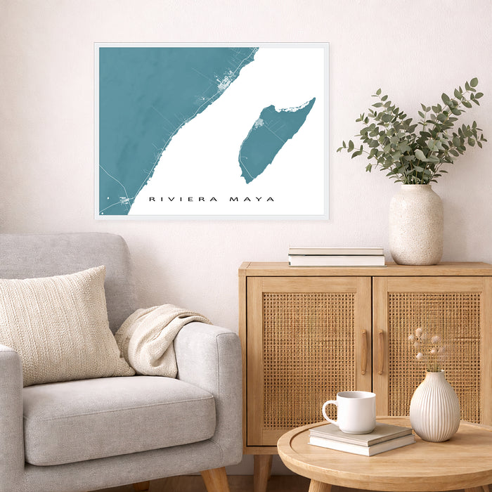 Living room with a map of Riviera Maya on the wall, a couch, and a wooden cabinet.