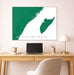 Map of Riviera Maya on a wall above a desk with a laptop and lamp.
