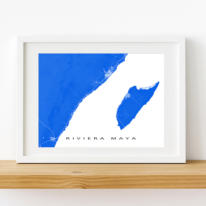 Framed map of Riviera Maya with a blue and white color scheme on a wooden shelf.