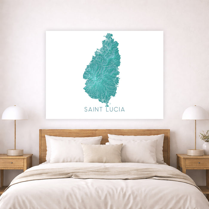 Framed map of Saint Lucia on a wall above a bed in a bedroom.