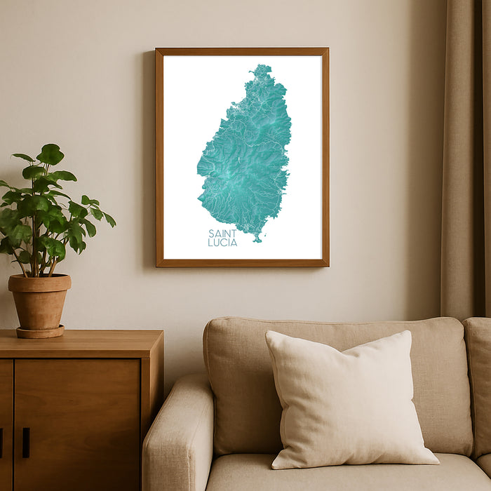 Framed map of Saint Lucia on a wall above a sofa with a plant beside it.
