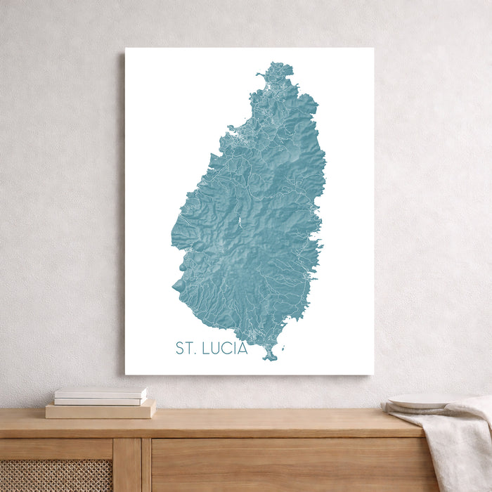 Map of St. Lucia on a white wall above a wooden surface