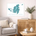 Living room with a map of Saint-Martin & Sint Maarten on the wall, a vase with plants, and a wooden cabinet.