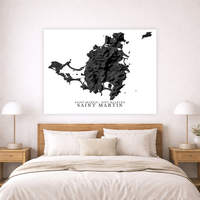 Map of Saint Martin on a wall above a bed in a bedroom setting