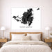 Map of Saint Martin on a wall above a bed in a bedroom setting