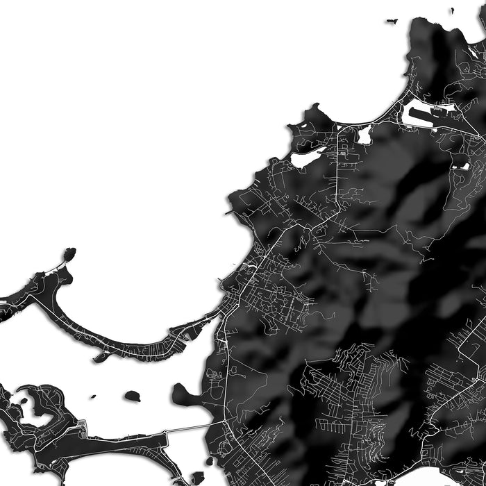 Black and white map of a coastal area with roads and water bodies.