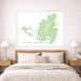 Map of Saint Martin on a wall above a bed in a bedroom setting