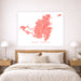 Map of Saint Martin on a wall above a bed in a bedroom setting