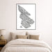 Framed black and white abstract art print above a bed in a bedroom.
