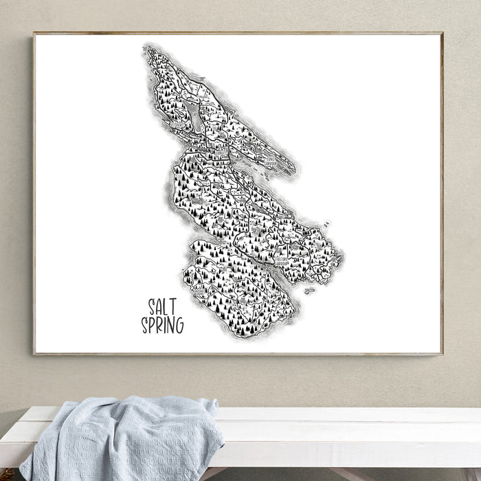 Framed black and white map of Salt Spring Island on a wall above a white bench.