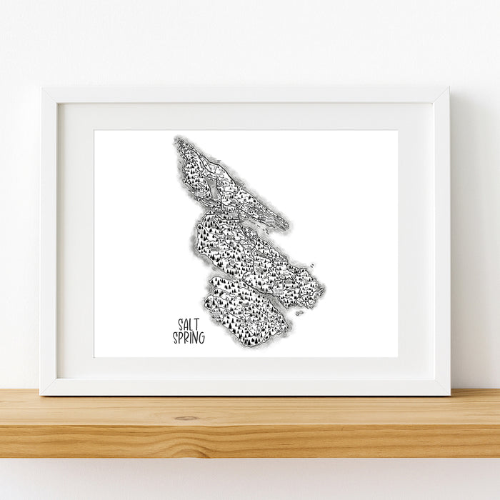 Framed black and white map of Salt Spring Island on a white wall.