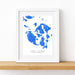 Framed map of San Juan Islands with blue ink blots on a white background