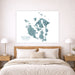 Map of San Juan Islands hanging above a bed in a bedroom.