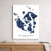 Map of San Juan Islands, Washington on a white wall above a wooden shelf.