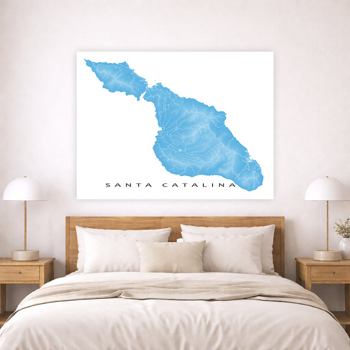 Map of Santa Catalina on a wall above a bed in a bedroom.