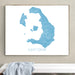 Framed map of Santorini on a wall above a white bench.