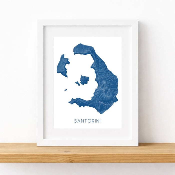 Framed map of Santorini on a white wall