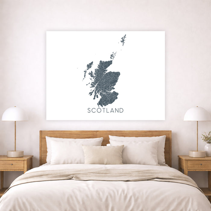 Map of Scotland on a wall above a bed in a bedroom