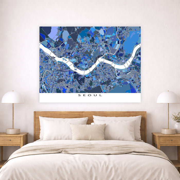 Map of Seoul on a wall above a bed with wooden headboard and nightstands.