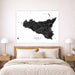 Map of Sicily on a wall above a bed in a bedroom setting
