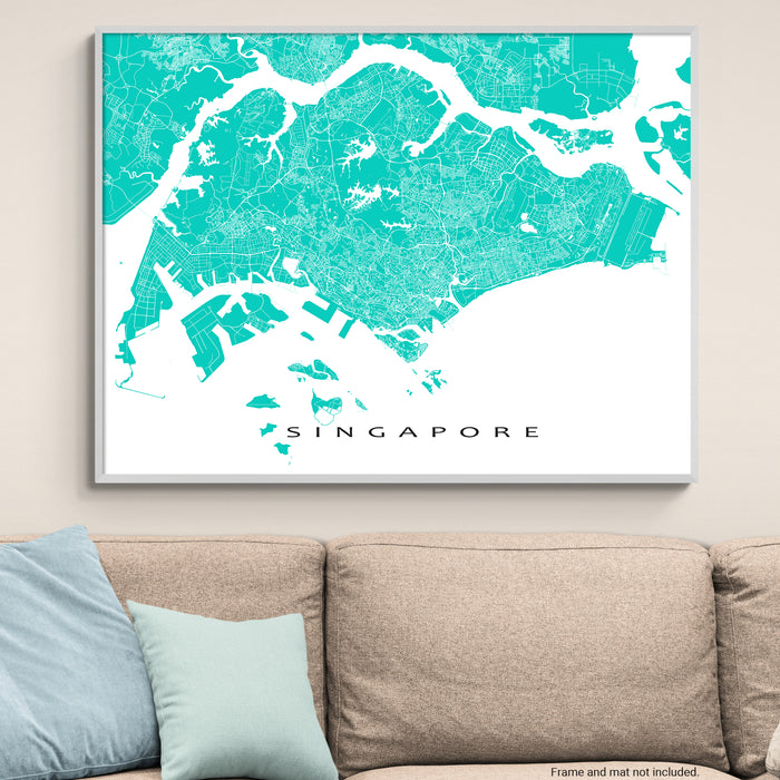 Framed map of Singapore on a wall above a beige sofa with light blue pillows.