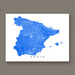 Map of Spain with blue roads on a white background, displayed against a brown wall.