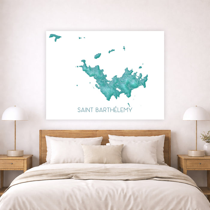Map of Saint Barthelemy on a wall above a bed in a bedroom.
