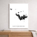 Map of Saint Barthélemy on a white wall above a wooden shelf.