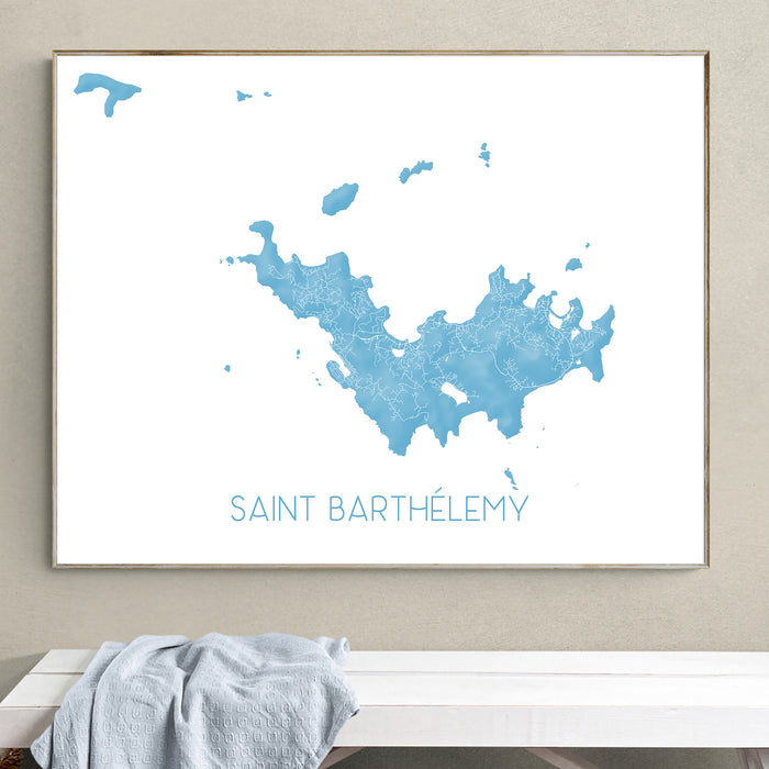 Framed map of Saint Barthélemy on a wall above a bench.