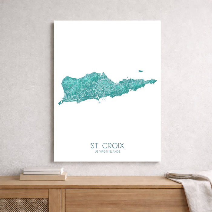 Map of St. Croix, US Virgin Islands on a white wall above a wooden surface.