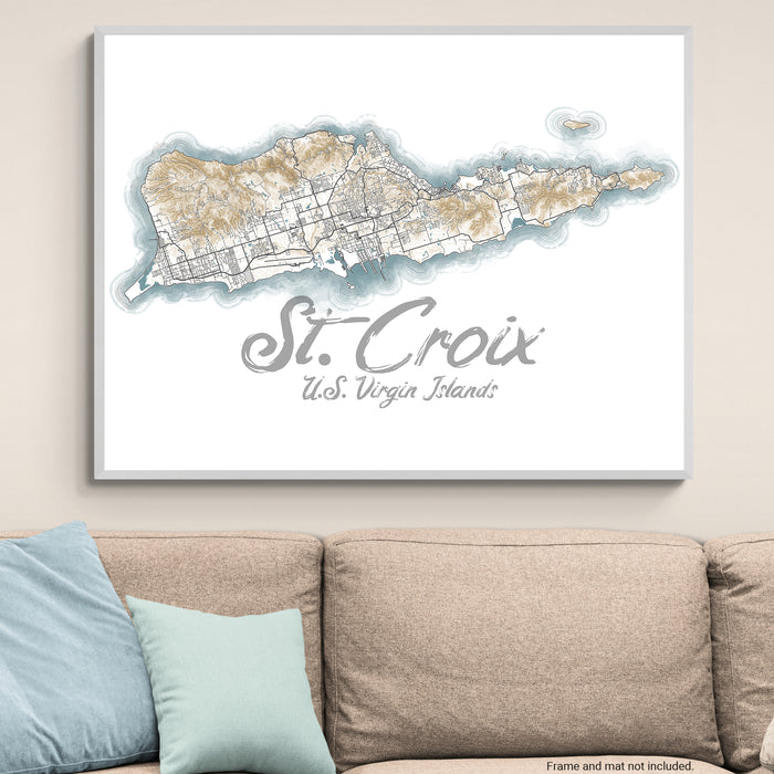 Framed map of St. Croix, U.S. Virgin Islands on a wall above a couch.