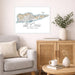 Living room with a map of St. Croix on the wall, a couch, and a wooden cabinet.