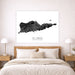Framed map of St. Croix on a wall above a bed in a bedroom.