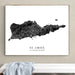Framed map of St. Croix, US Virgin Islands on a wall above a white bench.