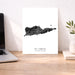 Map of St. Croix, US Virgin Islands on a white background next to a laptop on a wooden desk.