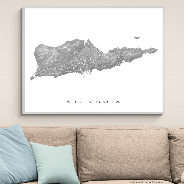 Framed map of St. Croix on a wall above a couch
