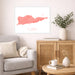 Living room with a gray sofa, wooden cabinet, and decorative items including a map of St. Croix.