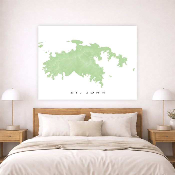Framed map of St. John on a wall above a bed with wooden headboard and nightstands.