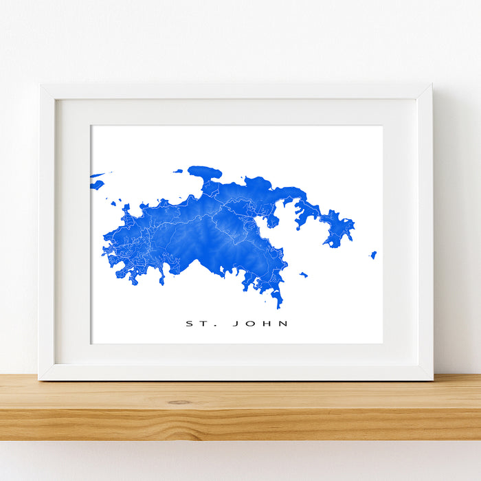 Framed blue abstract art print on a white wall