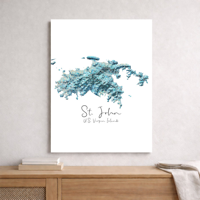 Framed map of St. John, U.S. Virgin Islands with blue watercolor design on a white wall.